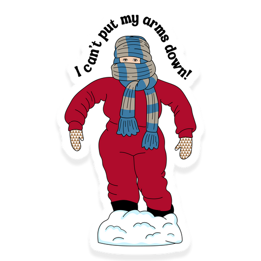 Bundled-up child in a snowsuit with scarf and mittens saying 'I can’t put my arms down!'