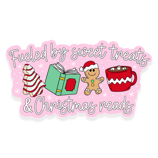 Christmas treats, book, gingerbread, and a mug with the phrase 'Fueled by sweet treats & Christmas reads.'